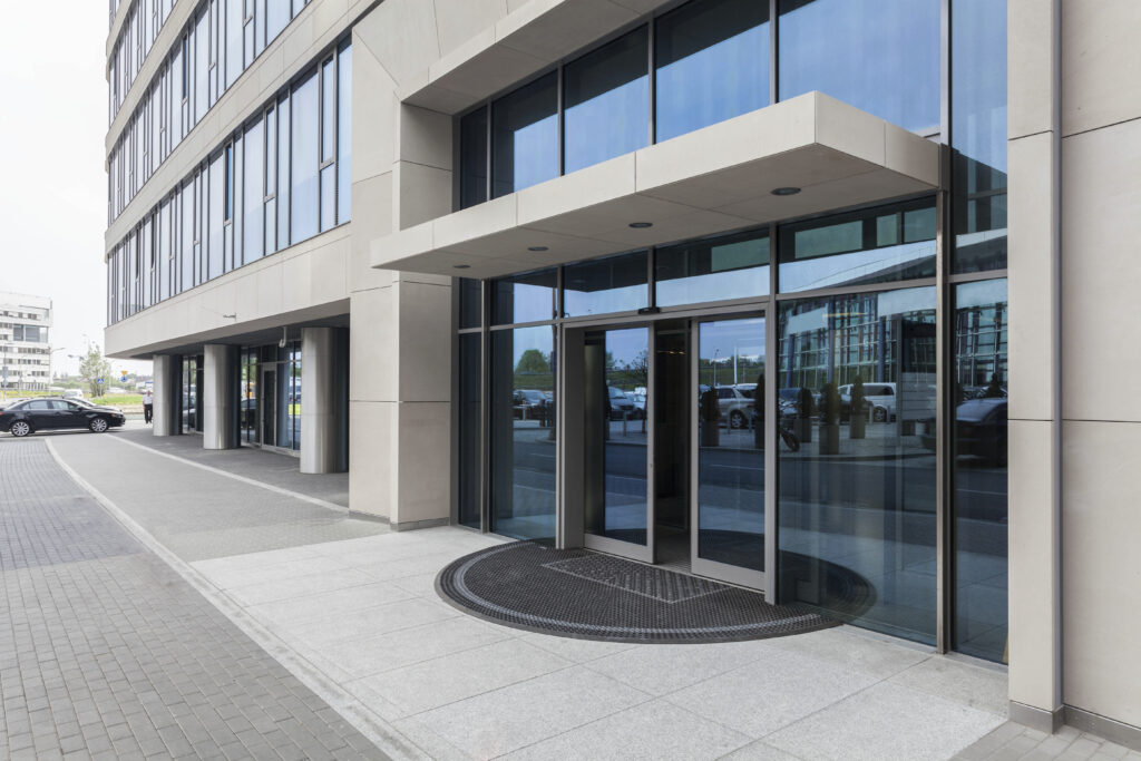double glass doors outside a corporate office building
